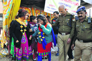 Protesting yoga teachers being taken away by the police in Dehradun on Monday