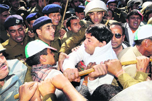 Uttarakhand Kranti Dal (Airy) workers jostle with the police during a protest demonstration in front of the state Assembly in Dehradun on Monday.