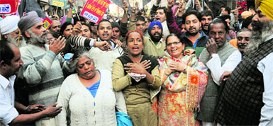 Residents stage a protest at the gate of the Town Hall complex, which houses the mayors office