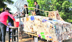 Students prepare a float for an upcoming carnival at the College of Art, Sector 10, on Tuesday.