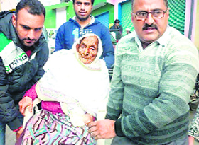 110-year-old Shahmala Begum comes to vote in Doda on Tuesday.