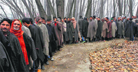 Voters line up to cast their votes during the first phase of the J&K Assembly elections at Dangarpora on Tuesday.