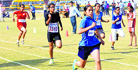 Athletes race during the inter-school athletics meet at GNPS in Ludhiana on Tuesday