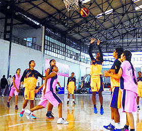 A player tries to basket the ball during the Indian School Basketball League in Ludhiana. 