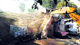 Encroachments being removed at Cheema Chowk. 