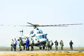 A Russian team along with members of the Indian Air Force alight from an Mi-17 helicopter at Air Force Station, Halwara, near Ludhiana