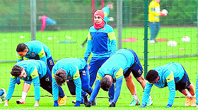 Arsenals Santi Cazorla (standing) takes part in a team training session in London on Tuesday, ahead of their UEFA Champions League Group D match against Borussia Dortmund.