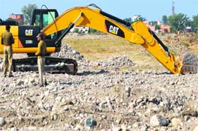 A machine impounded by the Haridwar police involved in illegal quarrying at the Kumbh mela land at the Bairagi camp in Haridwar on Tuesday