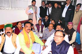 BJP legislators hold a protest at the Vidhan Sabha during the Assembly session in Dehradun on Tuesday