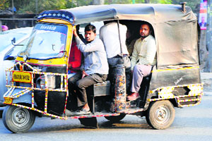 An overloaded auto-rickshaw is a common sight in Amritsar.