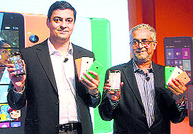 Nokia India MD Ajey Mehta (L) with chairman of Microsoft India Bhaskar Pramanik at the launch of Microsoft Lumia 535 smartphone in New Delhi on Wednesday. It is priced at Rs 9,199.