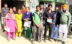 Residents protest outside a ration depot in Bathinda on Wednesday