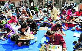 Students take part in a painting competition organised by the Sobha Singh Memorial Chittarkar Society