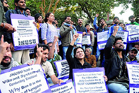 Actvists of the JNUSU protest outside the HRD Ministry, demanding scrapping of the Lyngdoh Committee recommendations on students' union election, in New Delhi on Wednesday. 