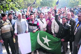Members of the Youth Christian Front, Punjab, with the Pakistani flag in Jalandhar on Wednesday