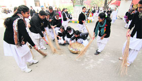 Students of Government College for Women, Parade, take part in the Swachh Bharat Abhiyaan in Jammu on Wednesday