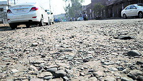 The bad condition of roads is a major problem in the ward; and (below) roadside encroachments. 