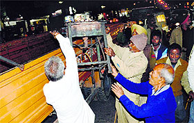 Temporary encroachments being removed from the Field Ganj area on Wednesday.