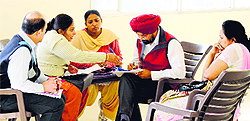 Team members question hospital staff in Ludhiana on Sunday