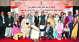 Sports Minister Sarbananda Sonowal with members of the 1964 Olympic gold-medal winning hockey team and their families at a felicitation function in New Delhi on Wednesday