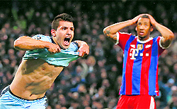 Manchester Citys Sergio Aguero celebrates after scoring the winner as Bayern Munichs Jerome Boateng reacts during their match in Manchester on Tuesday
