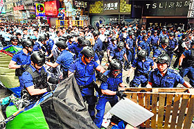 Police clear a pro-democracy protest site in the Mongkok district of Hong Kong on Wednesday. 