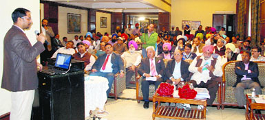 Local Bodies Minister Anil Joshi gives a presentation of the proposed revamping of water supply and sewer schemes for the holy city to a World Bank team and others in Amritsar on Thursday.