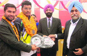 Bathinda lad Devinder Singh being felicitated at PKS International School at Baluana in Bathinda on Thursday.