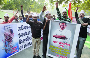 Activists of the Aam Aadmi Sena shouting slogans during their protest against Arvind Kejriwal at Jantar Mantar in New Delhi on Thursday