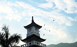Dark clouds loom over the historical Clock Tower in Mandi on Thursday