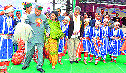Chief Minister Virbhadra Singh participates in a folk dance during the annual function of Portmore school, Shimla, on Thursday