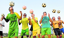 Players of the Youth Football Club Rurka Kalan ( YFC ) during a practice session at Rurka village in Jalandhar. The Rurkan Kalan Football Academy is a voluntary football academy that is managed by NRIs and foreign funds. It trains boys from villages without charging any money