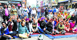 Residents hold a protest at Phagwara Gate in Jalandhar, demanding the registration of attempt to murder case against the accused