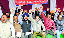 Members of the Non-Executive BSNL Association stage protest in Jalandhar on Thursday