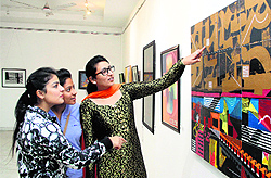 Girls visit the art exibition organised by Chandigarh Art College Old Students Association (CACOSA) at Virsa Vihar in Jalandhar on Thursday