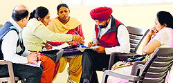 A team talks to the staff at the Civil Hospital