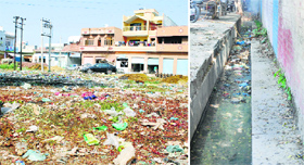 Garbage dumped in a street; and (right) an uncovered drain in Ajnala