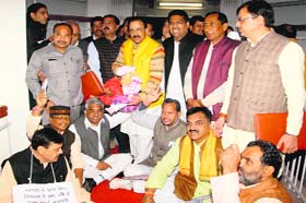 BJP legislators hold a protest at the Vidhan Sabha in Dehradun on Thursday