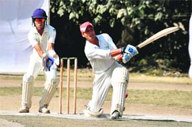 A batsman of Khalsa Cricket Academy plays a shot during a match in the Champion Cup Cricket Tournament at Rangers College Ground in Dehradun on Thursday