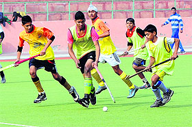 Players in action during the hockey match between Muktsar and the hosts in Bathinda on Friday. 