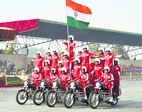 Women jawans hold aloft the Tricolour during the farewell ceremony for Director-General Dilip Trivedi at the CRPF centre in Gurgaon on Friday.