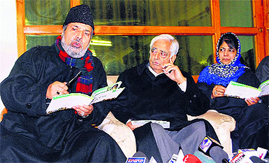 PDP patron Mufti Mohammad Sayeed along with party president Mehbooba Mufti and MP Muzaffar Hussain Beigh addresses the media at the release of their election manifesto in Srinagar on Friday.