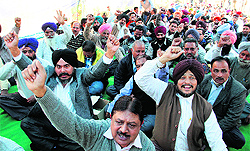 Members of the Council of Junior Engineers, PSEB, north zone, protest in support of their demands in Jalandhar on Friday