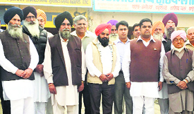 Members of the Jagraon Ahrtiya Association after a meeting at the grain market.