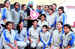 Players of Welham Girls School celebrate after winning the Under-15 District Level Basketball Championship at Doon International School in Dehradun on Friday
