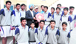 Players of Asian School with the winning trophy
