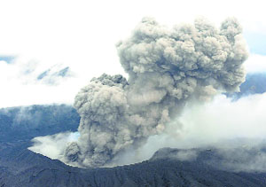 An aerial view shows volcanic smoke spew from Mount Aso in Aso, Kumamoto prefecture, Japan