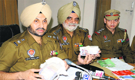 Senior police officials addresse mediapersons in Bathinda on Saturday.