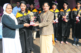 Principal Helen Decosta (right) felicitate a meritorious student in Bathinda.