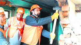 Moderate Hurriyat chairman Mirwaiz Umar Farooq formally launches the initiative by his charity unit to construct 100 houses for flood-hit people in Kashmir.